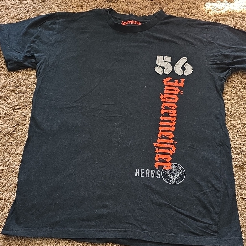 Jagermeister Black Tee with Vertical Orange Logo and White Accents